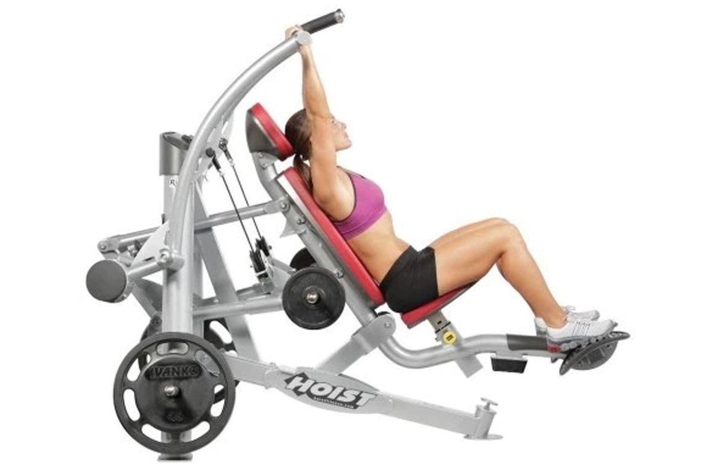 Hoist ROC-IT shoulder press machine with silver frame, red seat pad, and black weight plate, shown with model demonstrating e