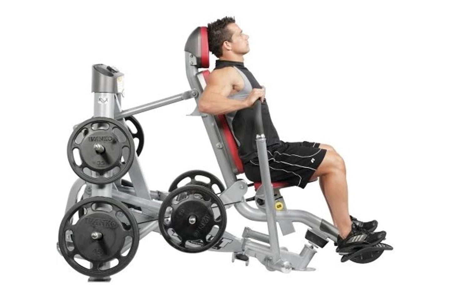 Man using gray and red Hoist abdominal exercise machine with weight plates, demonstrating seated crunch position