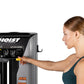 Woman in teal sports bra using Hoist ROC-IT Lat Pulldown machine with black and gray frame on white background