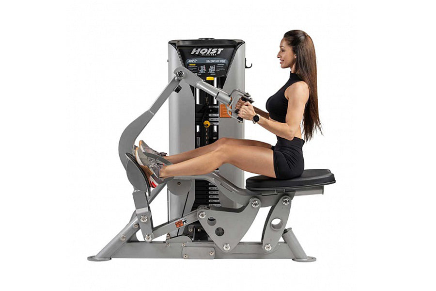Gray and black Hoist ROC-IT seated mid row machine with female model demonstrating proper form in black workout attire