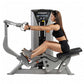 Hoist ROC-IT Seated Mid Row Machine with gray frame and black seat, woman in black workout attire using rowing handles in sea
