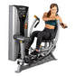 Hoist ROC-IT chest press machine with silver and black frame, woman in teal sports bra and black leggings demonstrating exerc