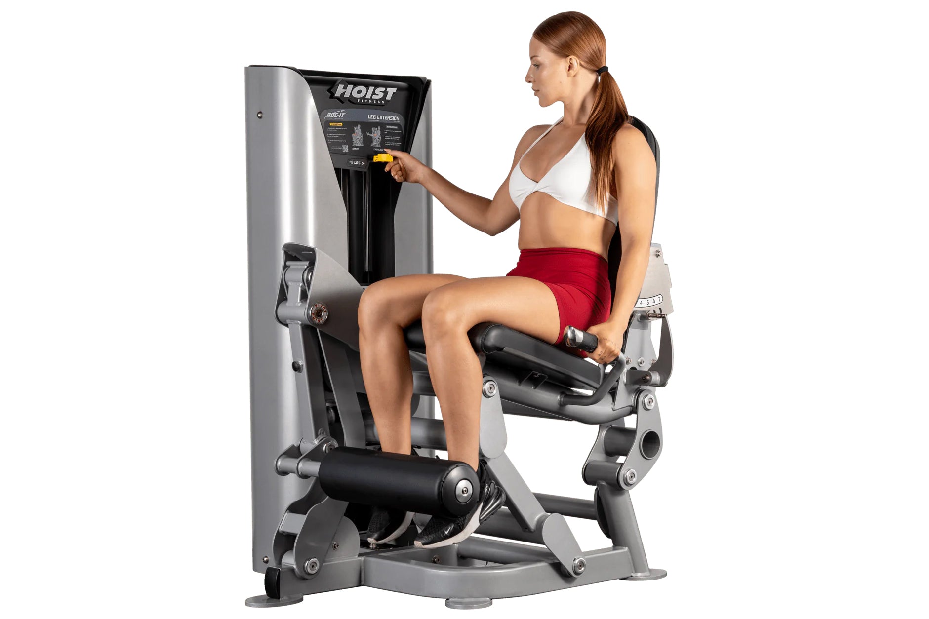 Woman using silver and black Hoist ROC-IT leg extension machine with padded seat and footrest