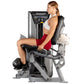 Woman using Hoist ROC-IT leg extension machine with silver frame and black seat, demonstrating proper form on white backgroun