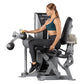 Woman using Hoist ROC-IT leg curl machine with dumbbells, silver and black fitness equipment on white background