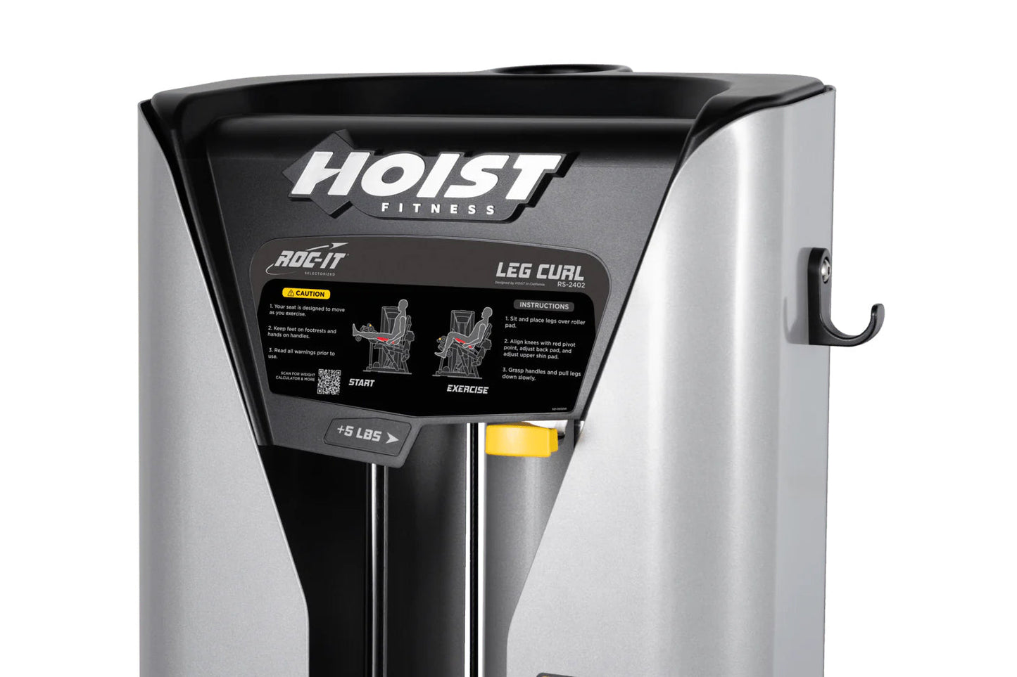 Hoist ROC-IT leg curl machine with black and silver frame, instruction panel, and yellow weight pin on white background