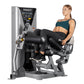 Woman using silver and black Hoist ROC-IT leg curl machine with digital display and padded leg extension attachment