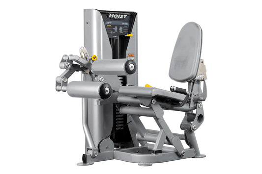 Hoist ROC-IT leg curl machine with gray and black frame, padded backrest and leg extension arms on white background