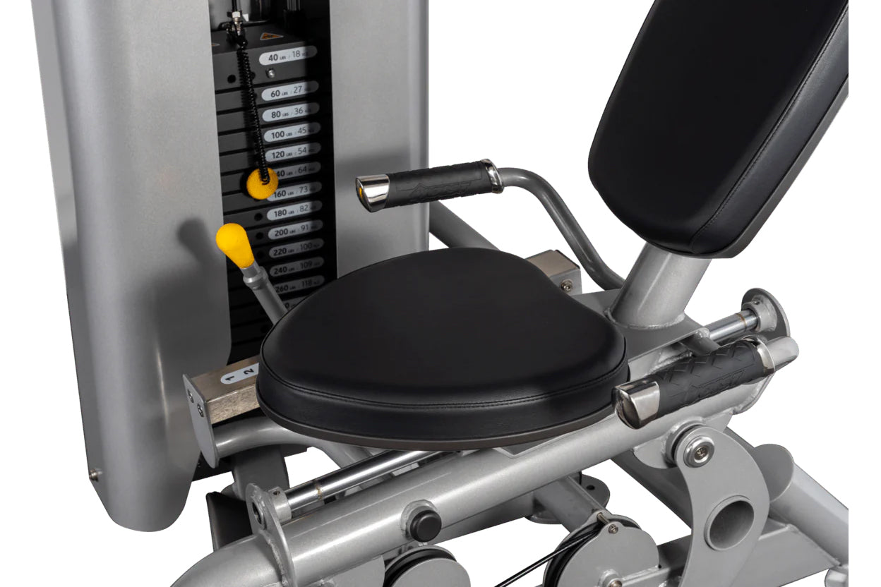 Hoist ROC-IT leg press machine with black padded seat, silver frame, weight stack with yellow adjustment pins, and chrome han