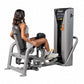Woman using gray and black Hoist leg press machine with padded seat and footrest on white background