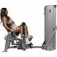 Woman using gray Hoist leg press machine with black accents, demonstrating proper form on equipment with extended leg platfor