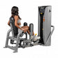 Woman using gray and black Hoist leg press machine with digital control panel, shown from side angle on white background
