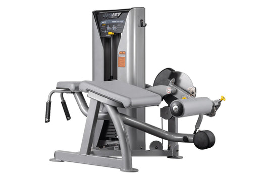 Hoist ROC-IT Prone Leg Curl Machine with silver frame, black padded seat and leg extension arm with weight stack on white bac