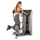Woman using gray and black Hoist rotary torso exercise machine with yellow handles, shown from side view on white background
