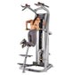 Silver and black Hoist ROC-IT chin/dip assist machine with dual handles, yellow accents, and footplate, demonstrated by model