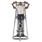 Man using silver and black chin dip assist machine with red and yellow handles, wearing white t-shirt and dark pants
