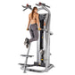 Woman using silver Hoist ROC-IT chin/dip assist machine with dual handles and yellow weight plates on white background