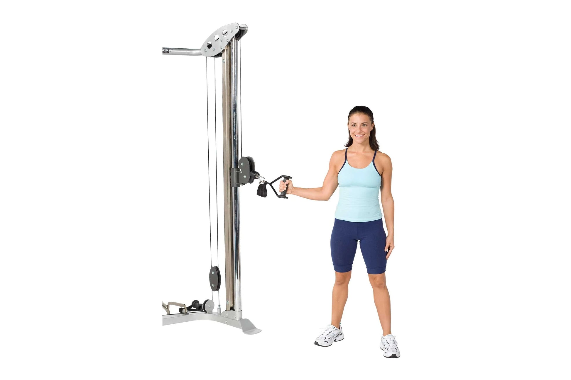 Woman demonstrating cable column exercise machine with pulley system and adjustable weights in silver and black finish