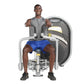 Man using gray Hoist pec fly machine with blue shorts, demonstrating chest exercise on white background