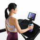 Woman wearing lavender sports bra and burgundy leggings using black Horizon 5.0 AT treadmill with screen display, holding wat