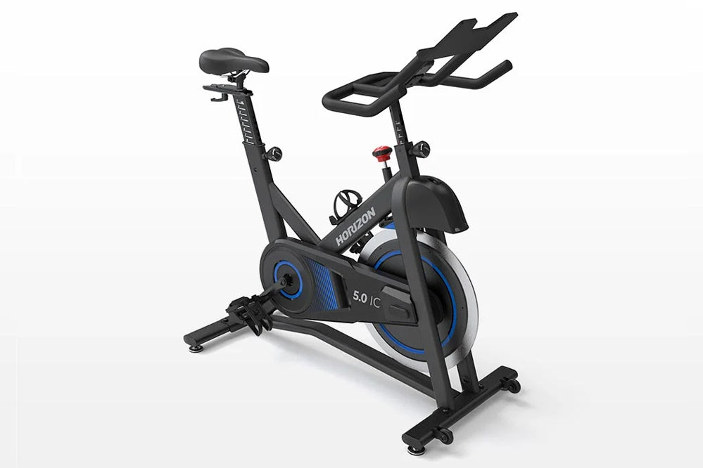 Horizon 5.0 IC indoor cycling bike with black frame, blue wheel accents, padded seat, and extended handlebars on white backgr