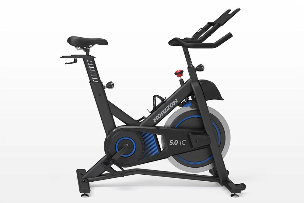 Horizon 5.0 IC black and blue indoor stationary bike with padded seat, handlebar display, and pedals on white background