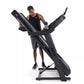 Man in black tank top using black Horizon treadmill with blue stripe accent on white background