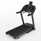 Black motorized treadmill with digital display console, handrails, and cushioned running belt on white background