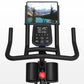 Black stationary exercise bike with curved handlebars, digital console displaying metrics and scenic mountain lake image, red