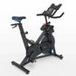Horizon 7.0 IC black and blue indoor stationary bike with blue seat, digital display console, and dual handlebars on white ba