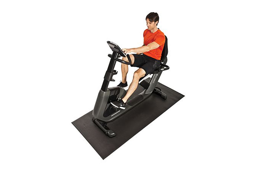 Horizon Comfort R recumbent exercise bike in gray and black with male model wearing orange shirt seated on equipment