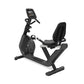 Black recumbent exercise bike with digital display console, padded seat, and sturdy frame base on white background
