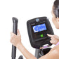 Woman wearing purple sports top using Horizon Evolve 3 elliptical machine with digital display console