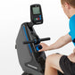 Man in blue shirt using gray and black Horizon Oxford 3 rowing machine with digital console display