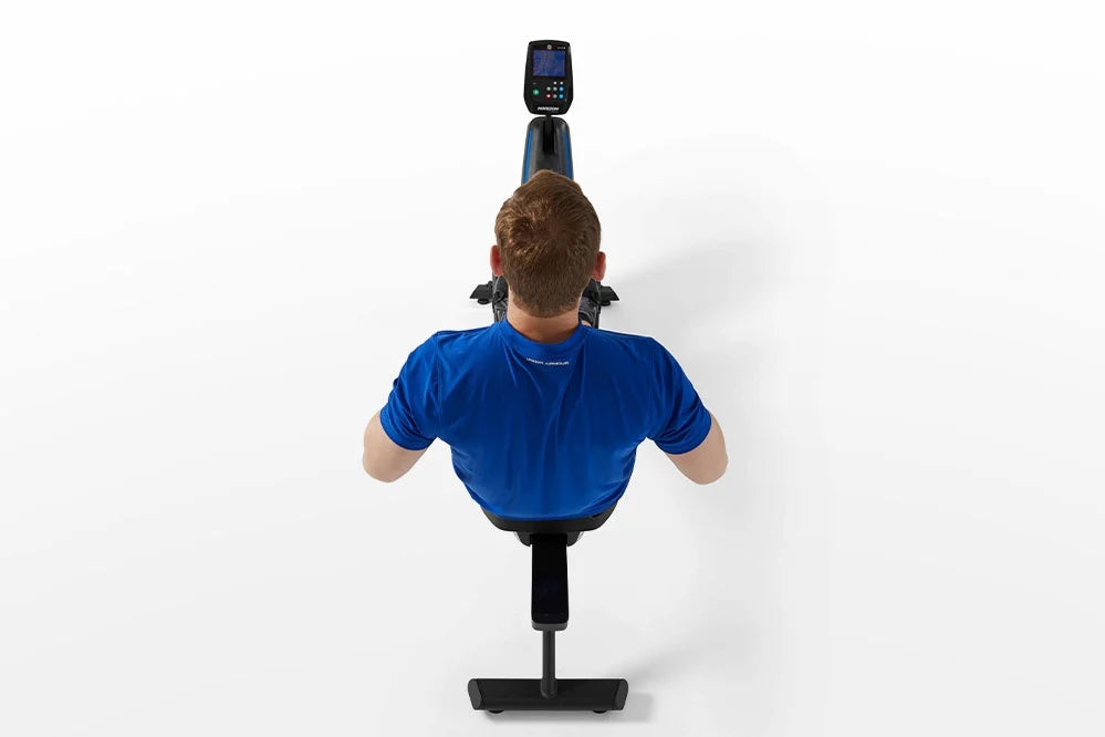 Person wearing blue shirt using black and blue Horizon Oxford 6 rowing machine, overhead view