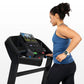 Woman in blue tank top and black leggings running on black Horizon T202 folding treadmill with digital display