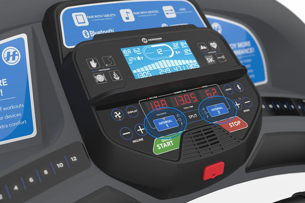 Horizon T303 folding treadmill console with blue display screen, black buttons, and colored control buttons including green s