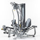Hybrid home gym with gray and black frame, padded seat and backrest, multiple exercise stations with weight stacks and cables