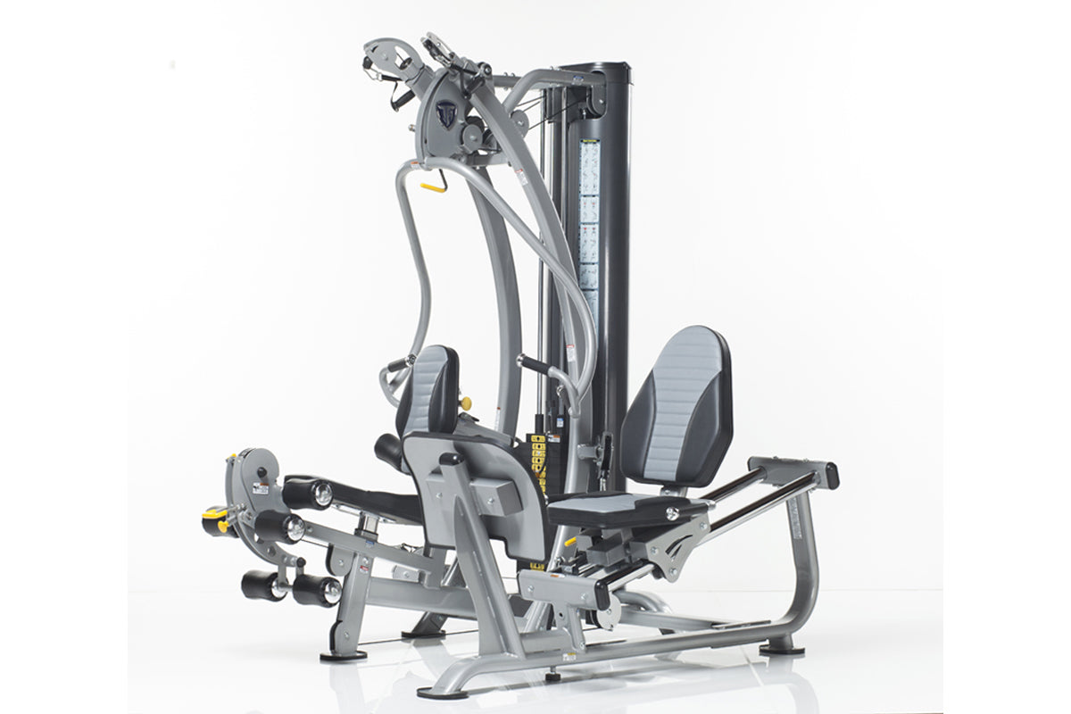 Hybrid home gym with gray and black frame, padded seat and backrest, multiple exercise stations with weight stacks and cables