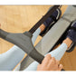 Person using Hydrow Arc rowing machine with gray and black frame, wearing navy shoes and light blue socks