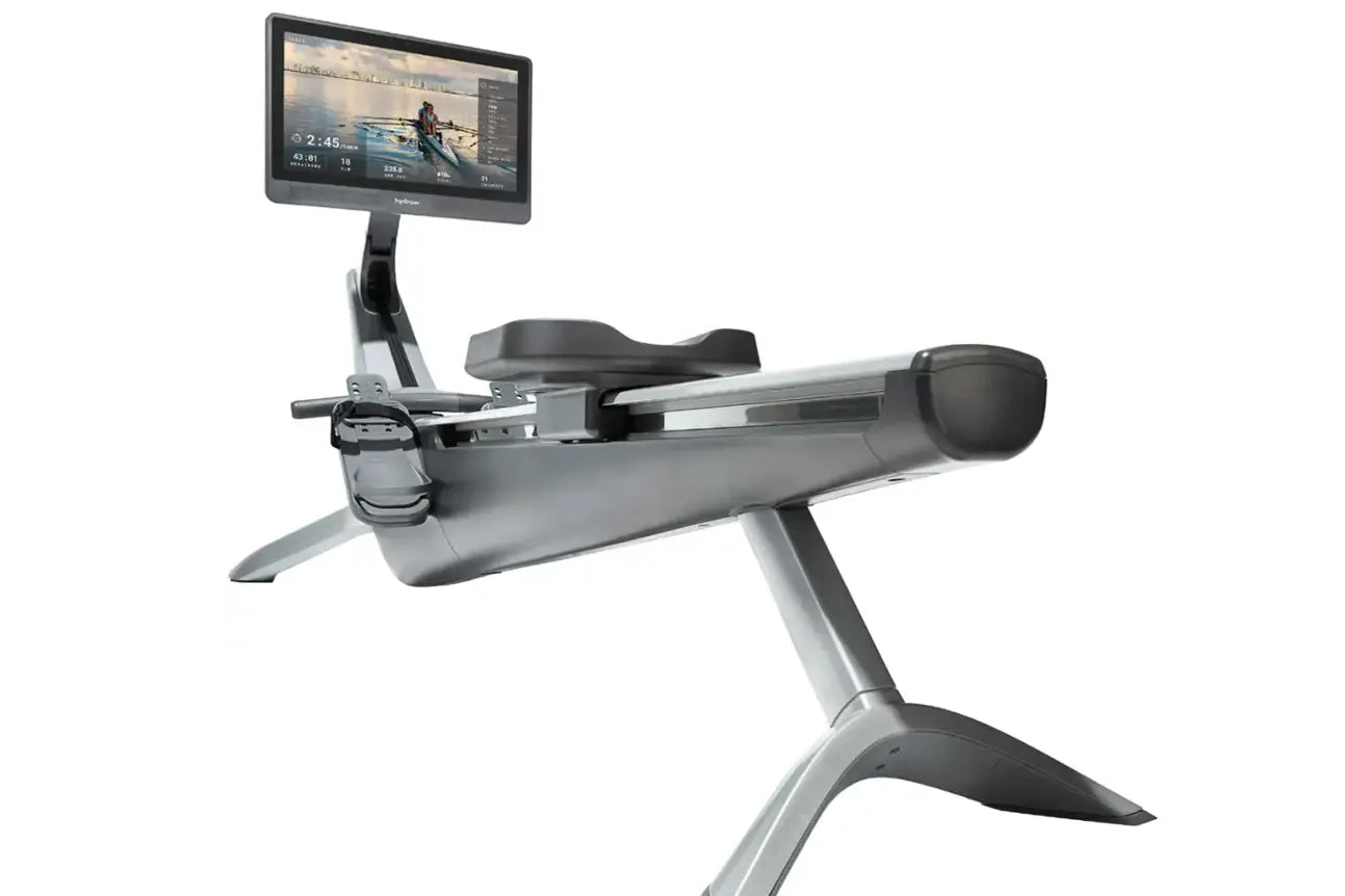 Hydrow Origin gray rowing machine with digital touchscreen displaying rowing workout video, on white background