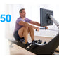 Man in purple shirt using black and white Hydrow Pro rowing machine with digital screen display