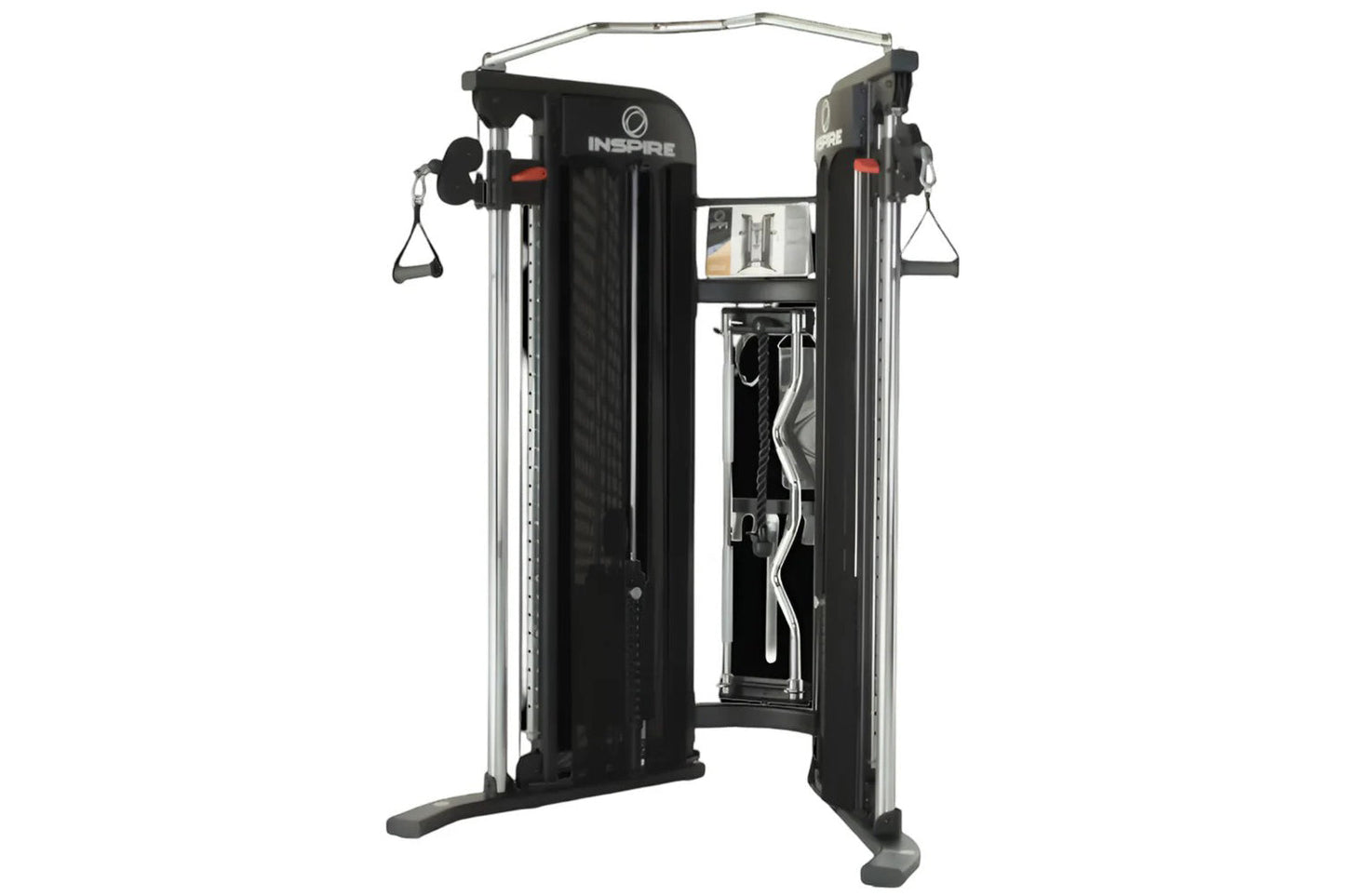 Inspire Fitness FT1 functional trainer with black panels, silver frame, dual weight stacks, and cable attachments on white ba