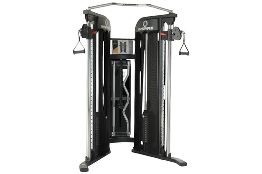 Inspire Fitness FT1 Functional Trainer with black uprights, silver frame, dual cable stations with handles, and adjustment di