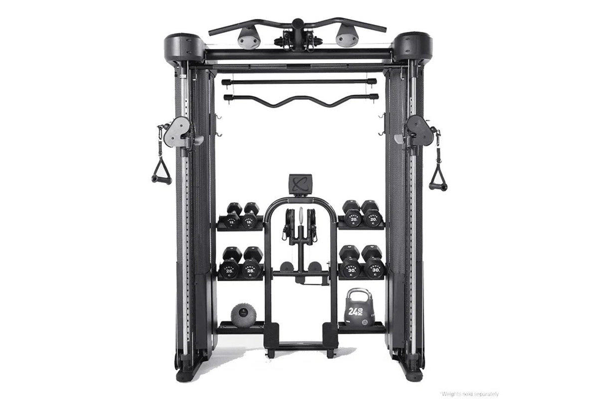 Black functional trainer machine with dual weight stacks, cable attachments, and integrated dumbbell storage on white backgro