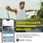 Man wearing white tank top using resistance bands outdoors near water, with smartphone displaying Centr fitness app and "3 mo
