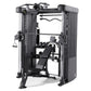 Black and silver Smith functional trainer with dual weight stacks, adjustable pulleys, and padded bench on white background
