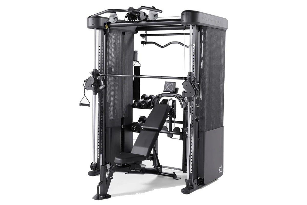Black and silver Smith functional trainer with dual weight stacks, adjustable pulleys, and padded bench on white background