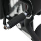 Black rubber dumbbell with metal collar and black nylon strap, shown hanging on multi-gym equipment