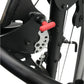 Black and red multi-gym system with adjustable lever and metal frame, detail view on white background